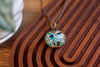 Streaked Green, Blue, and Black Fused Glass Pendant with Copper Wire Wrapping