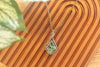 Green, Blue, and Black Fused Glass and Copper Wire Diamond Pendant