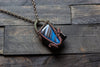 Black and Streaked Blue Glass Pendant with Copper Wire Wrapping