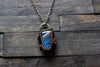 Black and Streaked Blue Glass Pendant with Copper Wire Wrapping