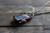 Black and Streaked Blue Glass Pendant with Copper Wire Wrapping