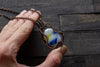 Streaked Blue, Yellow and White Fused Glass Pendant with Copper Wire Wrapping