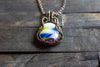 Streaked Blue, Yellow and White Fused Glass Pendant with Copper Wire Wrapping