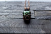 Glittery Dichroic Green Glass Pendant with Copper Wire Wrapping