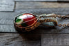 Copper pendant with red, green and white fused glass