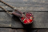 Copper pendant with red, green and white fused glass