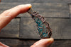 Abstract copper pendant with transparent blue fused glass