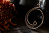 Circular Sterling Silver Wire Wrapped Pendant