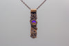 handmade copper bar necklace with clear iridescent fused glass and wire wrapping