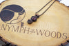 handmade copper bar necklace with pink fused glass and wire wrapping