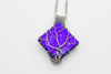 handmade sterling silver tree of life pendant with bright blue fused glass