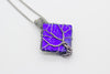 handmade sterling silver tree of life pendant with bright blue fused glass