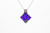 handmade sterling silver tree of life pendant with bright blue fused glass
