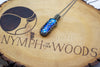 handmade pendant with bright blue fused glass and sterling silver wire wrapping