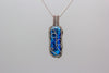 handmade pendant with bright blue fused glass and sterling silver wire wrapping