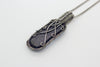 handmade pendant with bright blue fused glass and sterling silver wire wrapping