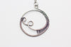 handmade circular pendant with sterling silver wire wrapping