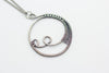 handmade circular pendant with sterling silver wire wrapping