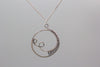 handmade circular pendant with sterling silver wire wrapping