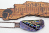 large handmade copper tree of life pendant on dichroic black and blue fused glass