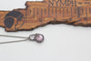 handmade small pendant with pink fused glass and sterling silver wire wrapping