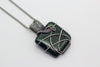 handmade dichroic green fused glass and sterling silver wire wrapped pendant