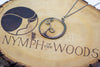 Handmade circular sterling silver wire wrapped pendant
