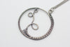 Handmade circular sterling silver wire wrapped pendant