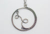 Handmade circular sterling silver wire wrapped pendant