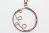 Handmade circular copper wire wrapped pendant