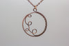 Handmade circular copper wire wrapped pendant