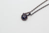 Handmade pendant with dark blue dichroic fused glass and copper wire wrapping