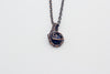 Handmade pendant with dark blue dichroic fused glass and copper wire wrapping