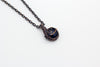 Handmade pendant with dark blue dichroic fused glass and copper wire wrapping