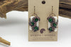 Handmade earring with white and dark green fused glass and copper wire wrapping