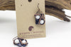 handmade white and dark blue fused glass earrings with copper wire wrapping from Nymph in the Woods