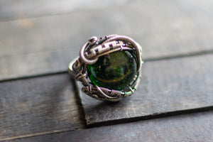 sterling silver statement ring with glittery green dichroic fused glass