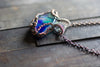 Streaks of Blue and Green Fused Glass Pendant with Copper Wire Wrapping