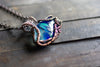 Streaks of Blue and Green Fused Glass Pendant with Copper Wire Wrapping