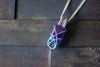 Dichroic Purple and Green Crisscross Sterling Silver Wire Wrapped Pendant