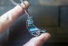 Streaks of Blue and Green Crescent Moon Pendant with Copper Wire Wrapping