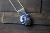 Silver, Blue, and White Crisscross Sterling Silver Wire Wrapped Pendant