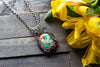 Copper Wire Wrapped Pendant with Blue-green and Orange Glass