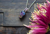 Dichroic Blue, Purple, and Gold Crisscross Sterling Silver Wire Wrapped Pendant