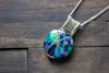 Reserved- Green, Purple, and Blues Crisscross Sterling Silver Wire Wrapped Pendant