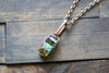 Streaked Green and Blue Fused Glass and Copper Wire Crisscross Pendant