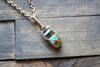 Streaked Green and Blue Fused Glass and Copper Wire Crisscross Pendant