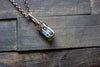 Streaked Green and Blue Fused Glass and Copper Wire Crisscross Pendant