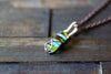 Streaked Green and Blue Fused Glass and Copper Wire Crisscross Pendant