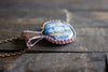 Copper Wire Wrapped Pendant with Snowflake on Streaked Blue Fused Glass